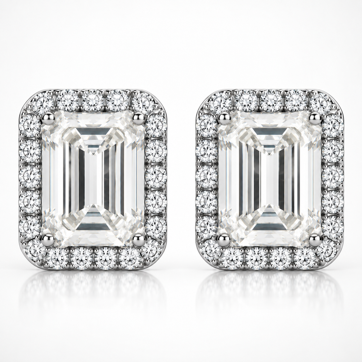 Silver emerald cut halo moissanite stud earrings shown front-on against a white background
