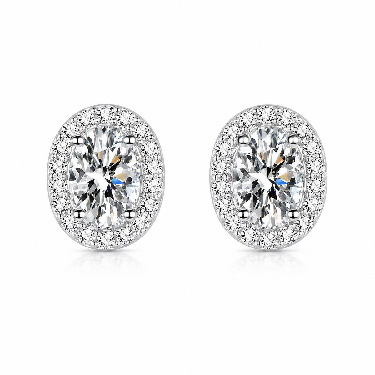 Silver oval halo moissanite stud earrings on a white background