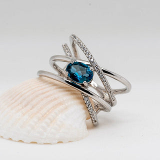"The Atomic Topaz" London Blue Topaz Crossed Band Ring - Premium Jewelry from Dazzling Delights - Just $56.25! Shop now at Dazzling Delights
