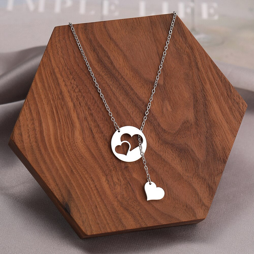 Silver Titanium Hollow and Solid Hearts Pendant Necklace - Premium Jewelry from Dazzling Delights - Just $22.95! Shop now at Dazzling Delights
