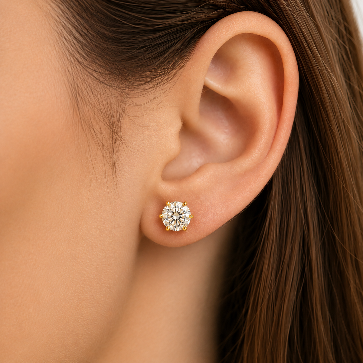 White gold six-prong black moissanite stud earrings shown front and side on a white background