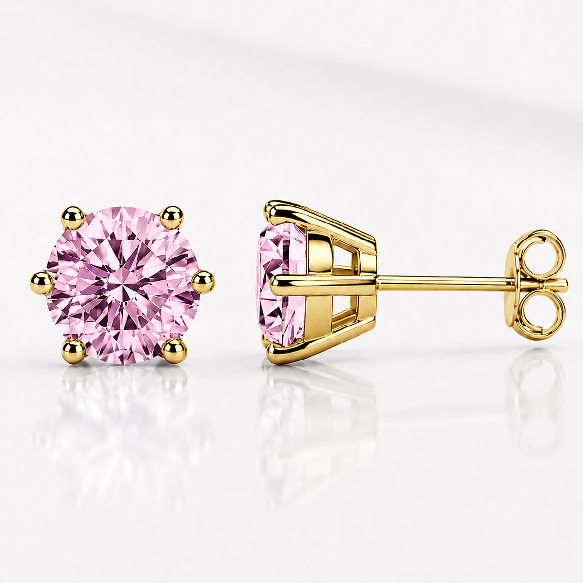 Yellow gold six-prong hot pink moissanite stud earrings shown front and side on a white background