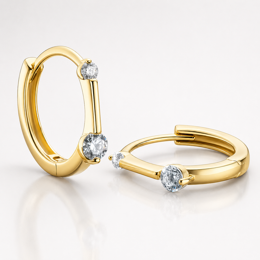 Gold floating moissanite hoop earrings with two round colourless stones shown on a white background