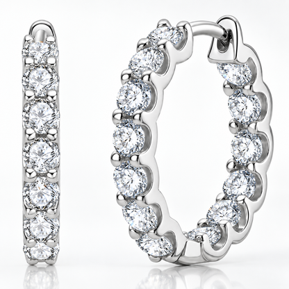 Silver inside-out moissanite hoop earrings with round stones on a white background