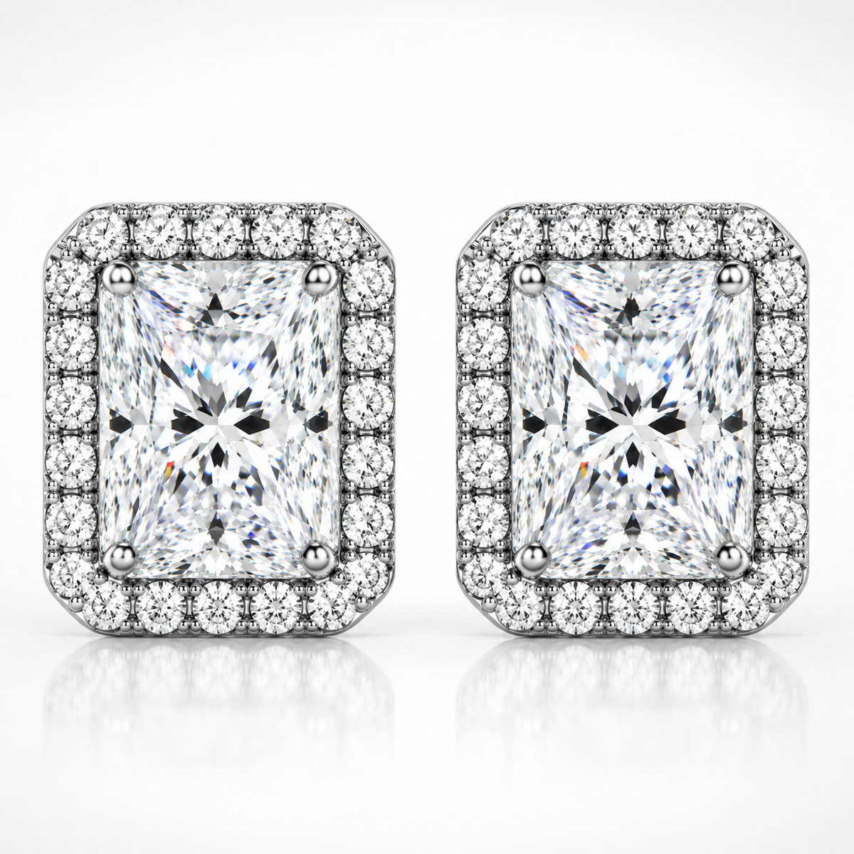 Silver radiant cut halo moissanite stud earrings shown front-on against a white background