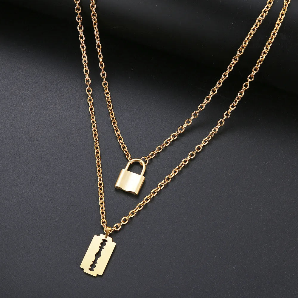 Titanium Double Layer Lock and Blade Pendant Necklace - Premium Jewelry from Dazzling Delights - Just $29.95! Shop now at Dazzling Delights