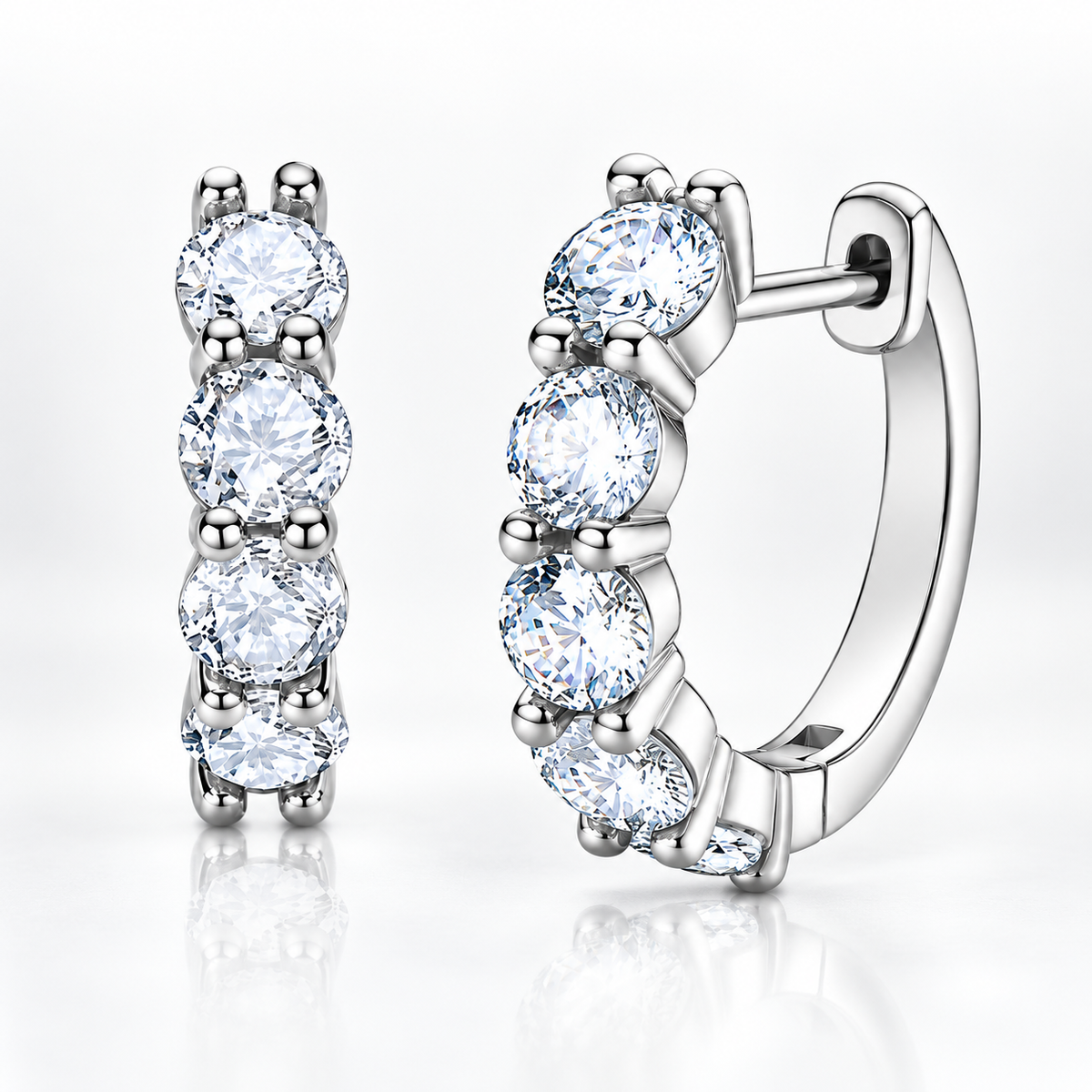 Silver five-stone moissanite hoop earrings on a white background