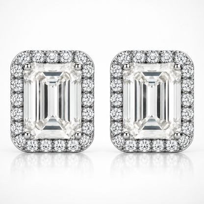 Silver emerald cut halo moissanite stud earrings shown front-on against a white background