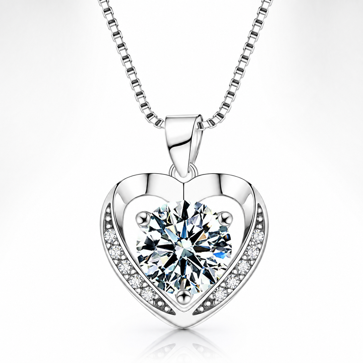 Silver shimmering heart moissanite pendant with a large round center stone and pavé side accents.