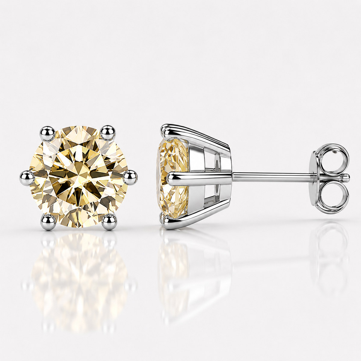 Yellow gold six-prong colourless moissanite stud earrings shown front and side on a white background
