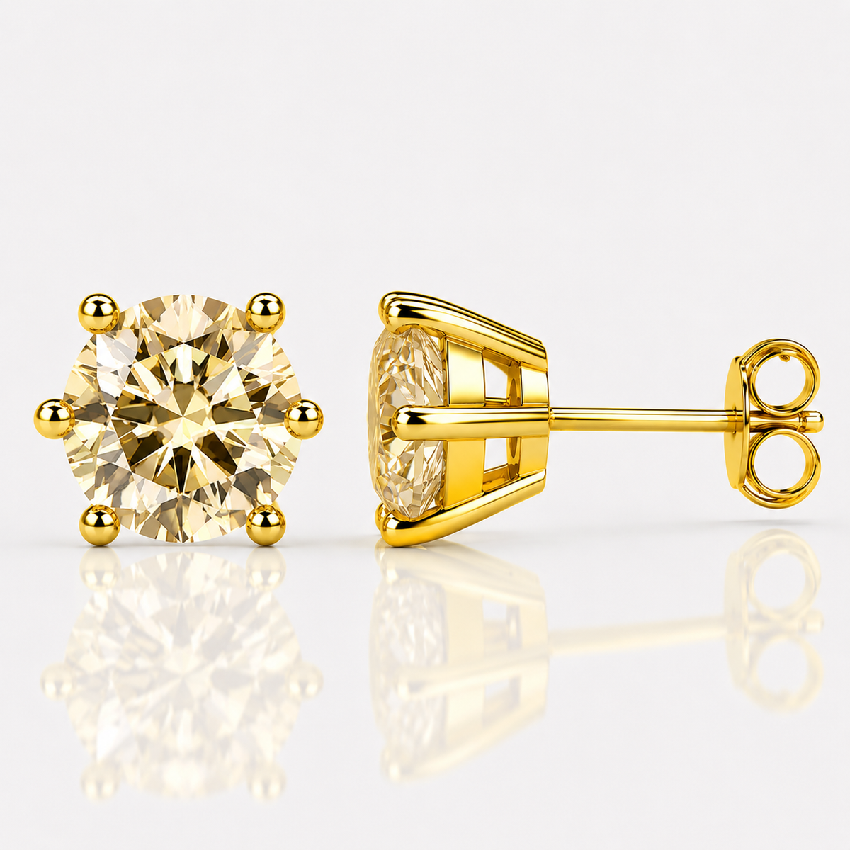 White gold six-prong blue-green moissanite stud earrings shown front and side on a white background