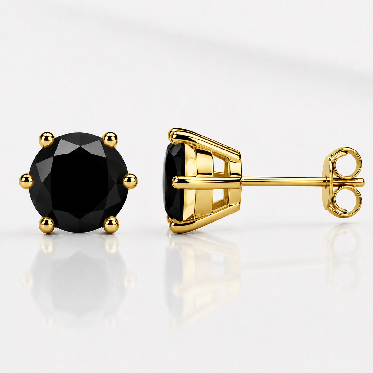 Yellow gold six-prong royal blue moissanite stud earrings shown front and side on a white background