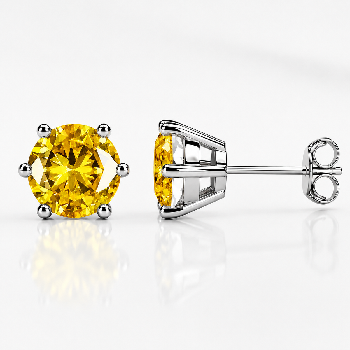 Yellow gold six-prong black moissanite stud earrings shown front and side on a white background