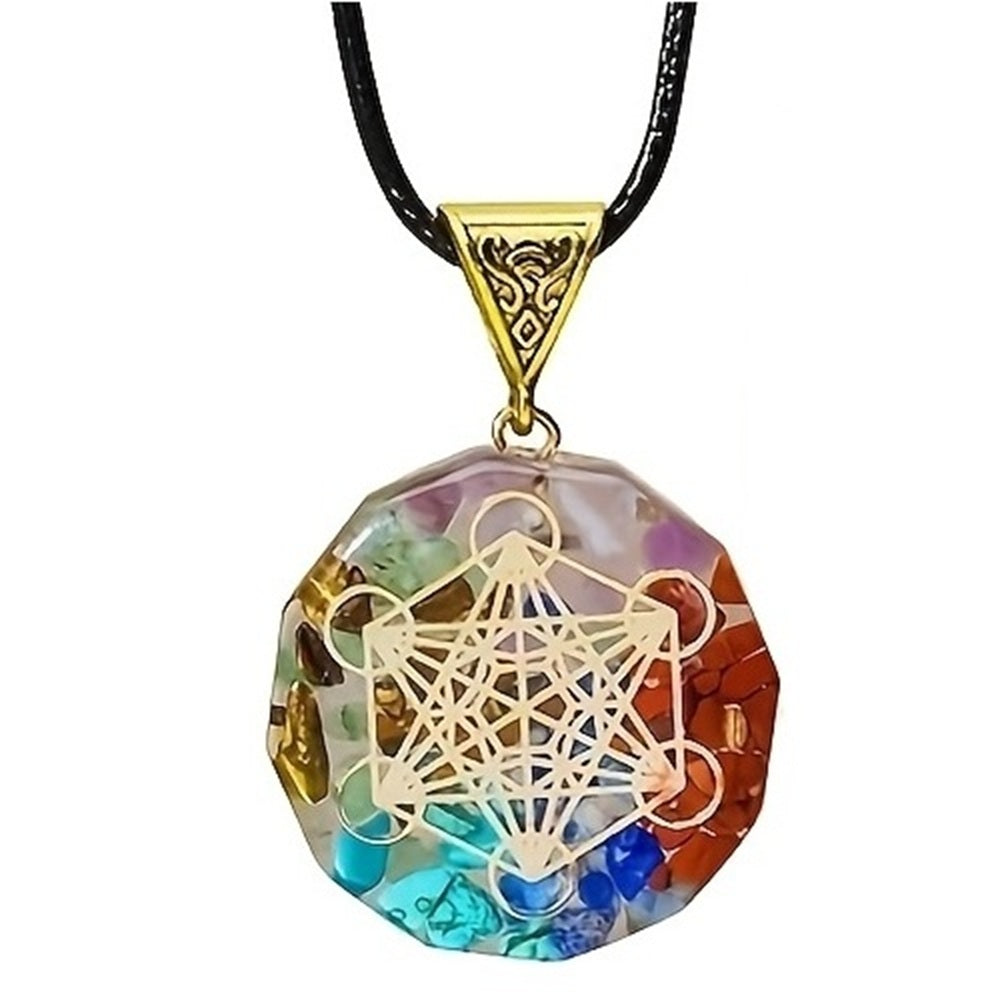 Close-up of a 12-sided chakra pendant featuring a gold sacred geometry design and embedded multicoloured natural gemstone chips on a black cord.