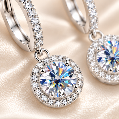 Macro close-up of a silver halo colourless moissanite hoop drop earring on champagne satin