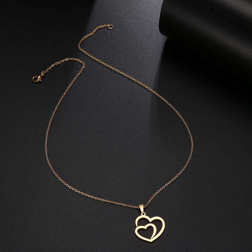 Gold Titanium Double Heart Pendant Necklace - Premium Jewelry from Dazzling Delights - Just $28.95! Shop now at Dazzling Delights