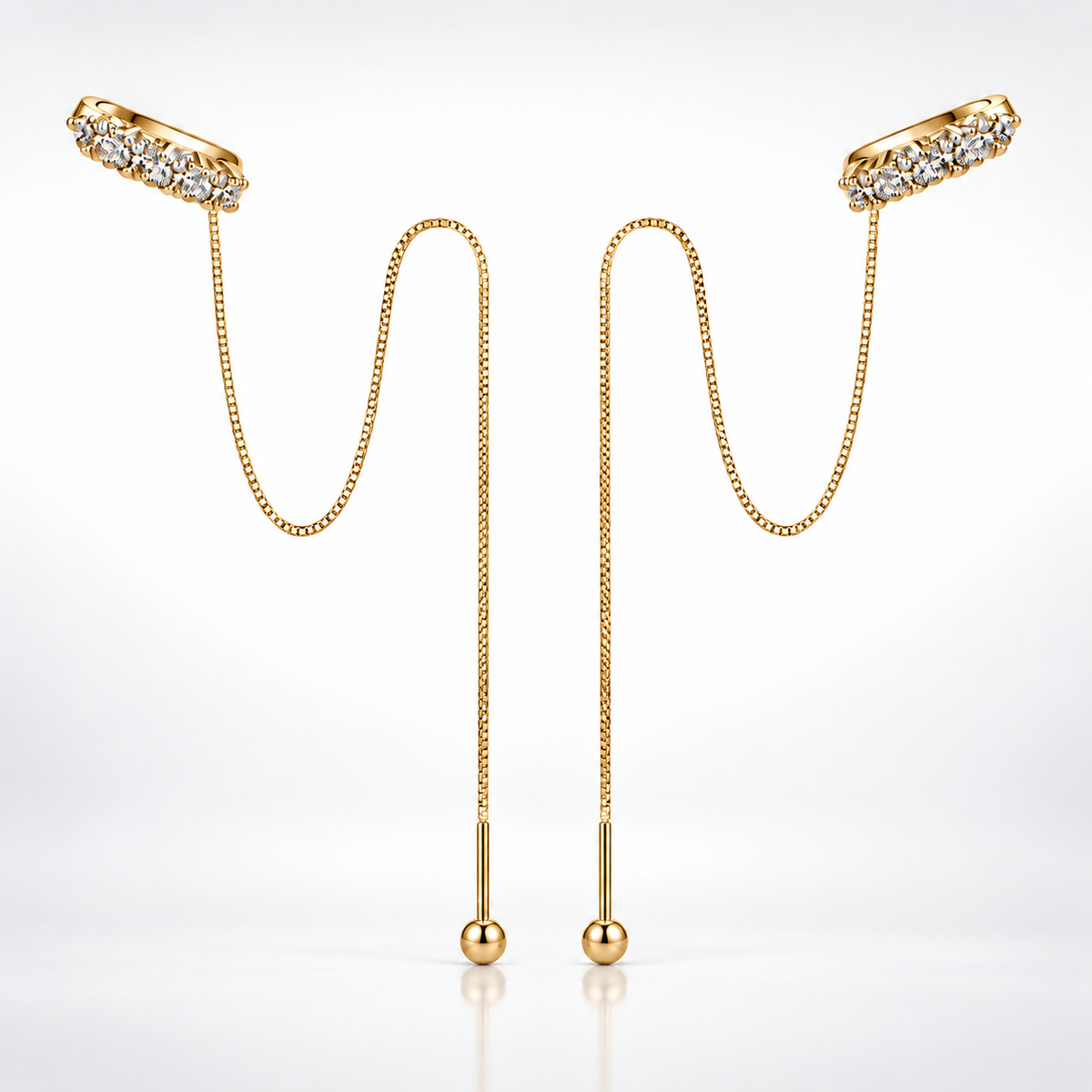 Gold moissanite threader chain earrings with curved stone-set tops shown on a white background