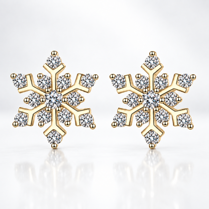 Gold snowflake moissanite stud earrings on a white background