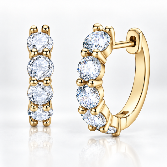 Gold five-stone moissanite hoop earrings on a white background