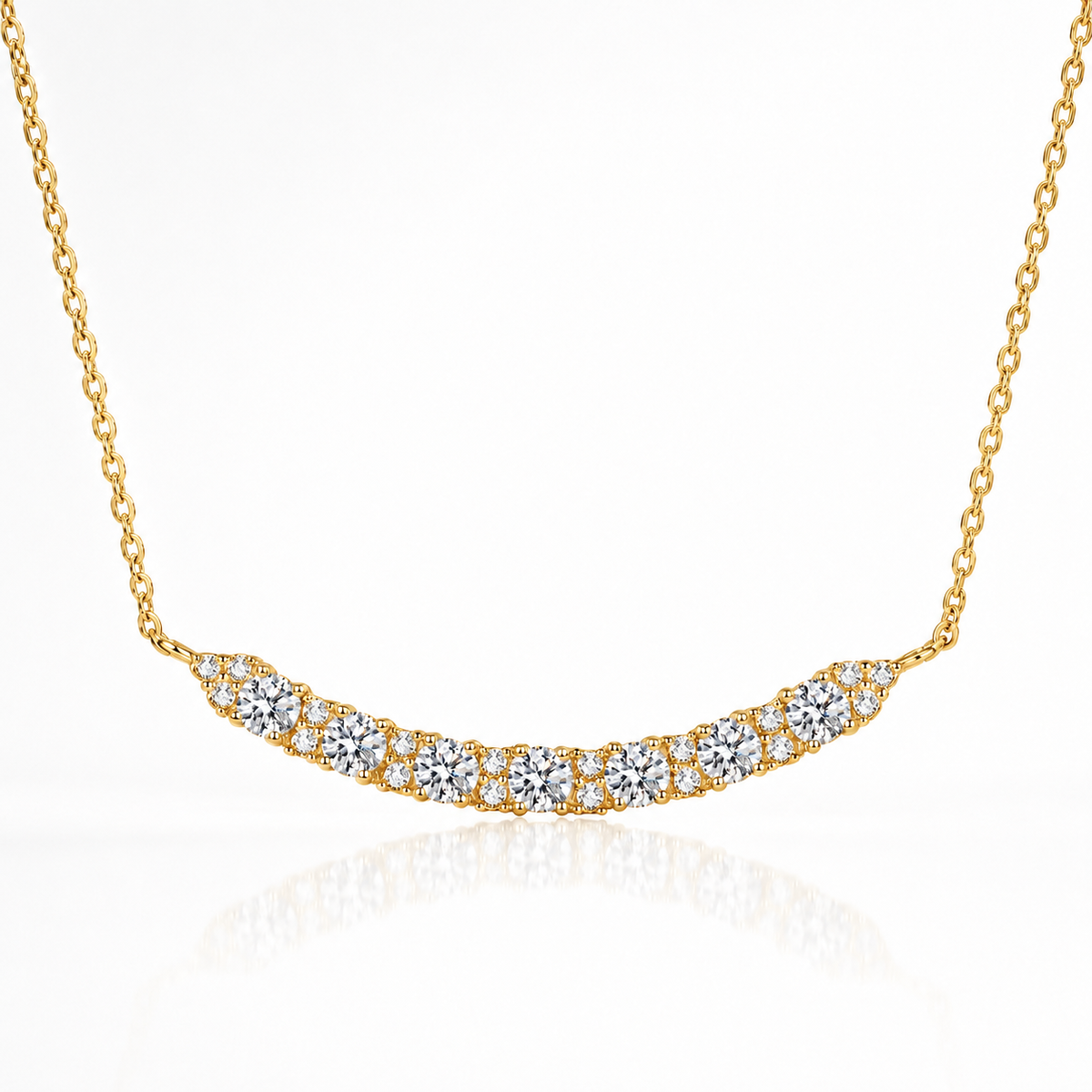 Yellow gold curved moissanite bar necklace with a sparkling row of round stones on a white background.