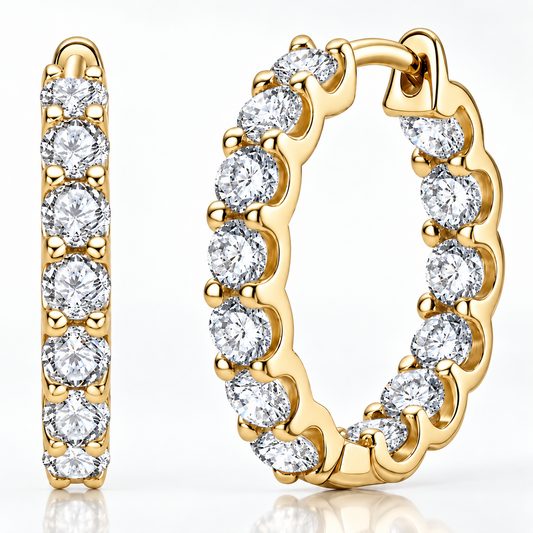 Gold inside-out moissanite hoop earrings with round stones on a white background
