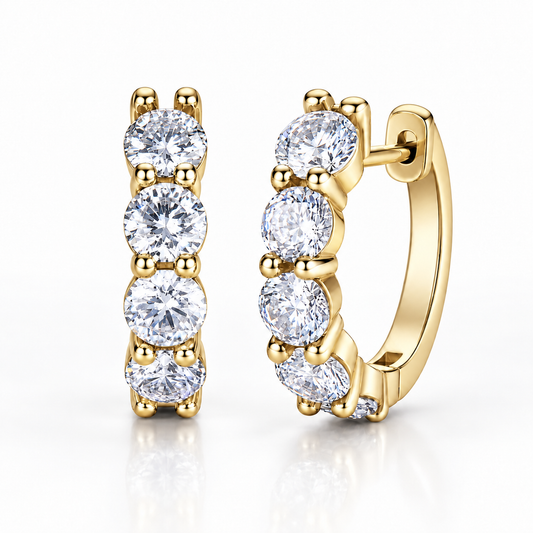 Gold five-stone moissanite hoop earrings on a white background