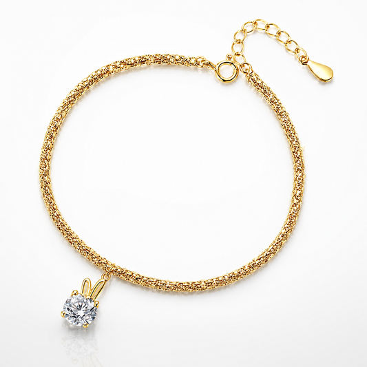 Yellow gold-tone bunny ear solitaire moissanite bracelet with round centre stone and adjustable extender chain