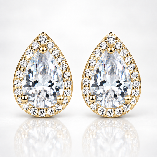 Gold pear-cut halo moissanite stud earrings on a white background
