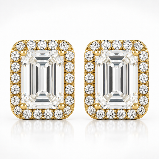 Gold emerald cut halo moissanite stud earrings shown front-on against a white background