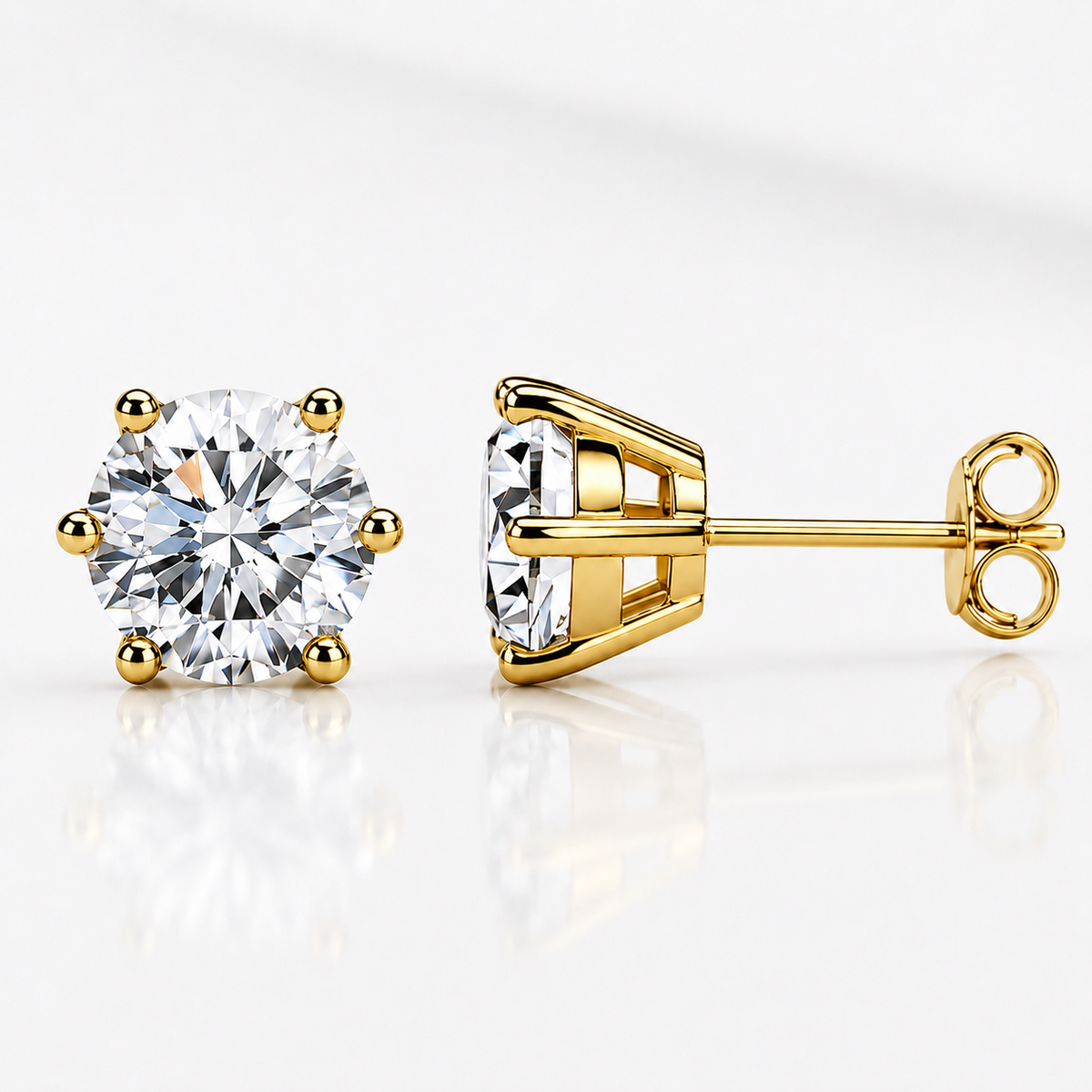 Yellow gold six-prong colourless moissanite stud earrings shown front and side on a white background