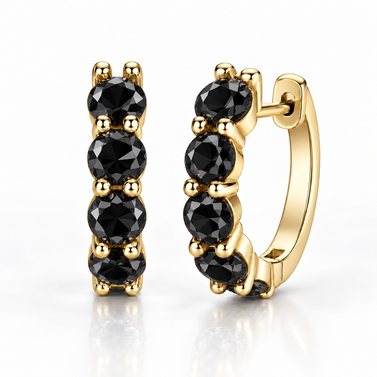 Gold five-stone hoop earrings with black moissanite on a white background