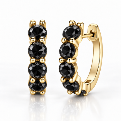Gold five-stone hoop earrings with black moissanite on a white background