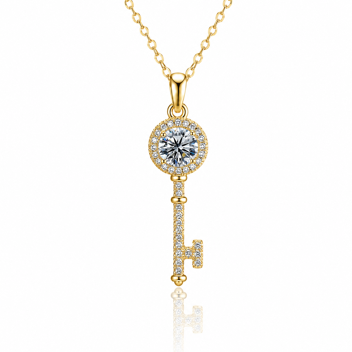 Yellow gold key pendant necklace with a round clear center stone, pavé halo and pavé key stem on white.