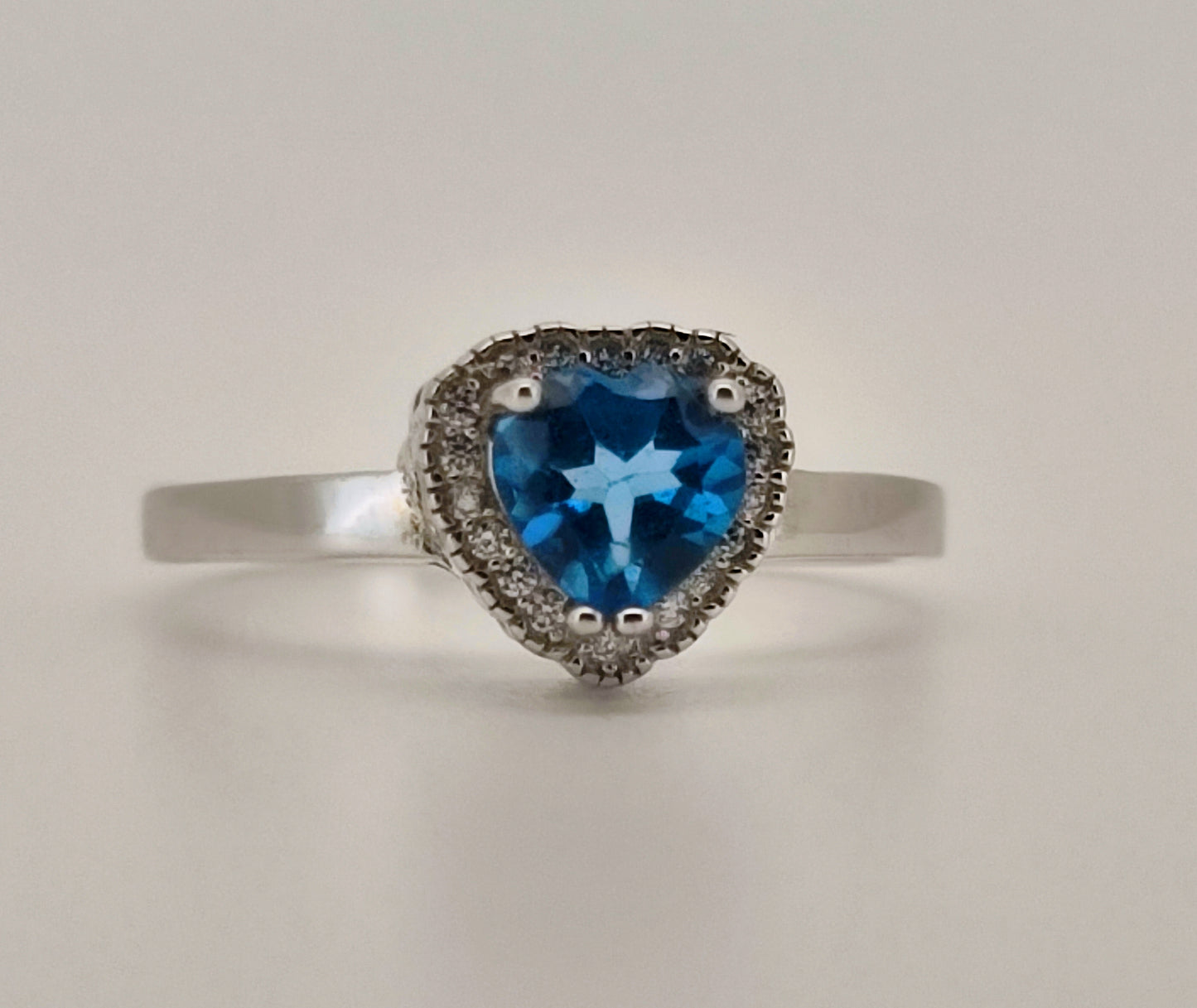 Heart Cut Swiss Blue Topaz and White Topaz Halo Ring