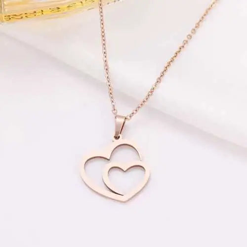 Gold Titanium Double Heart Pendant Necklace - Premium Jewelry from Dazzling Delights - Just $28.95! Shop now at Dazzling Delights